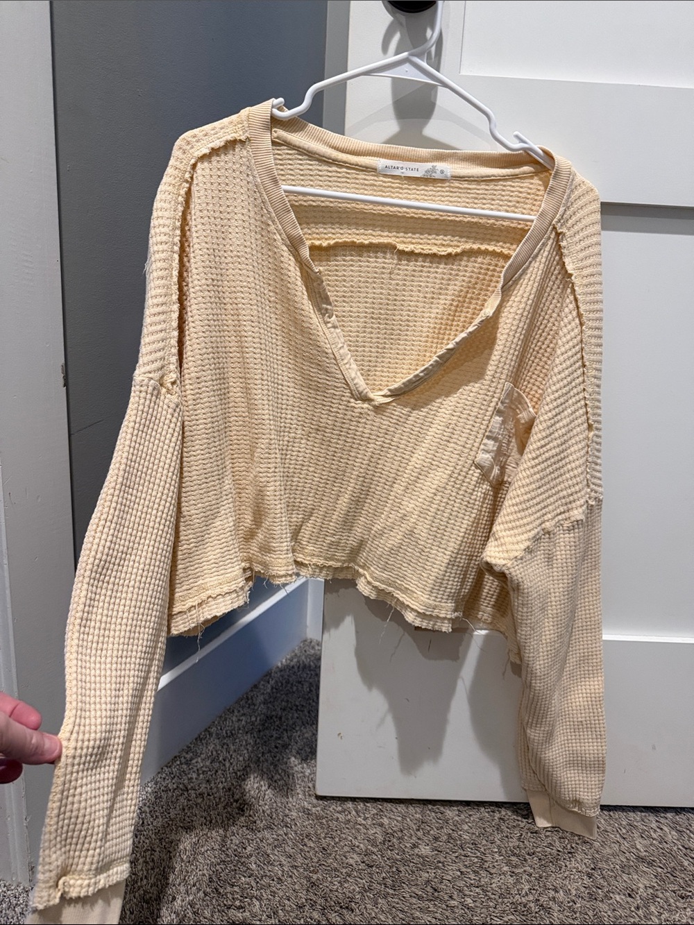 Altar’d State Cropped Waffle-Knit Raw-Edge V-Neck Sweater in Cream